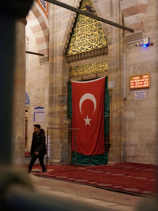 a po of a flag hanging inside of a building