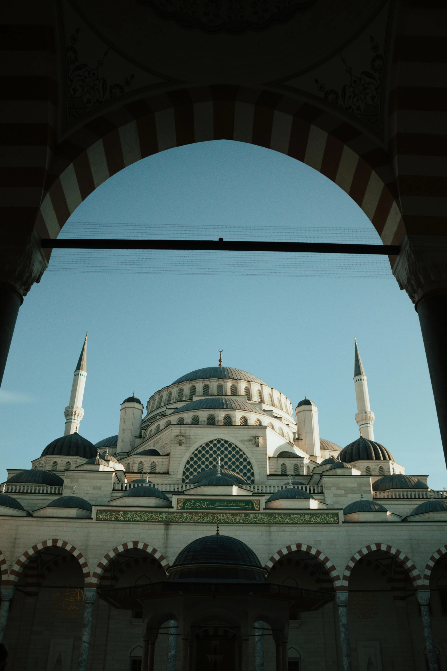 view of a building from below through an archway