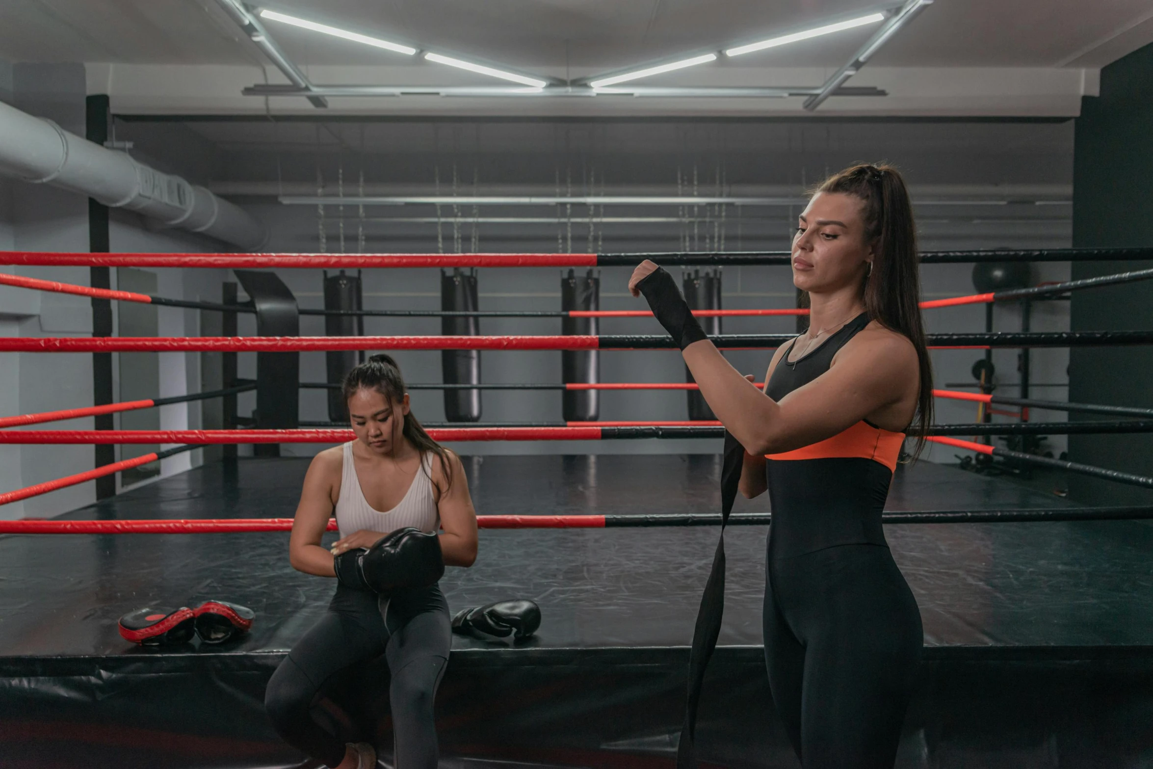 two women in a ring one getting ready for a fight