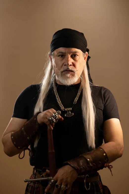 a man with long white hair wearing a long beard