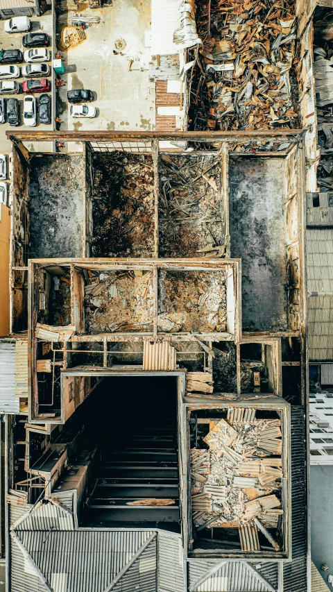 an old wood and metal wall with many pictures hanging on it