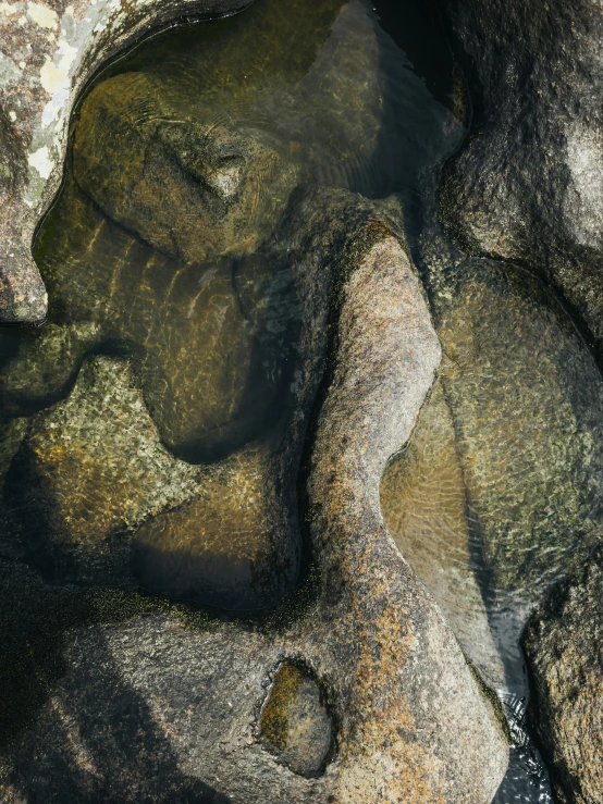 a body of water surrounded by rocks