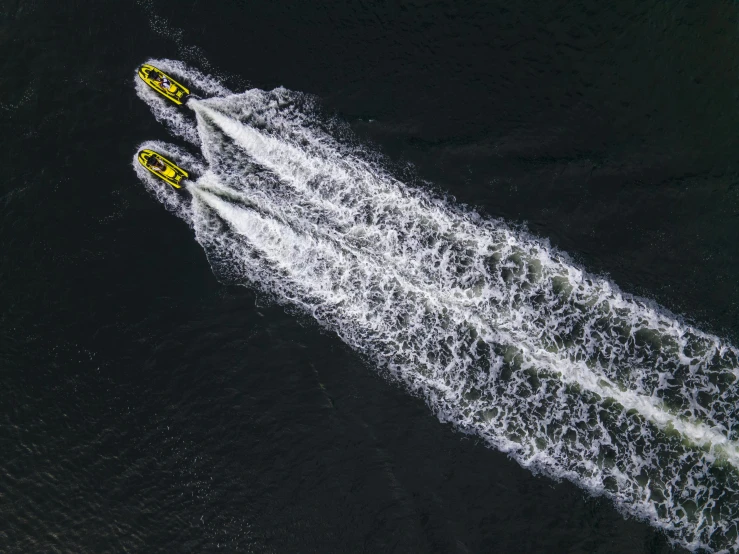 a couple of speed boats that are out in the water