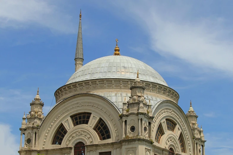 a very large white building that has spires on it