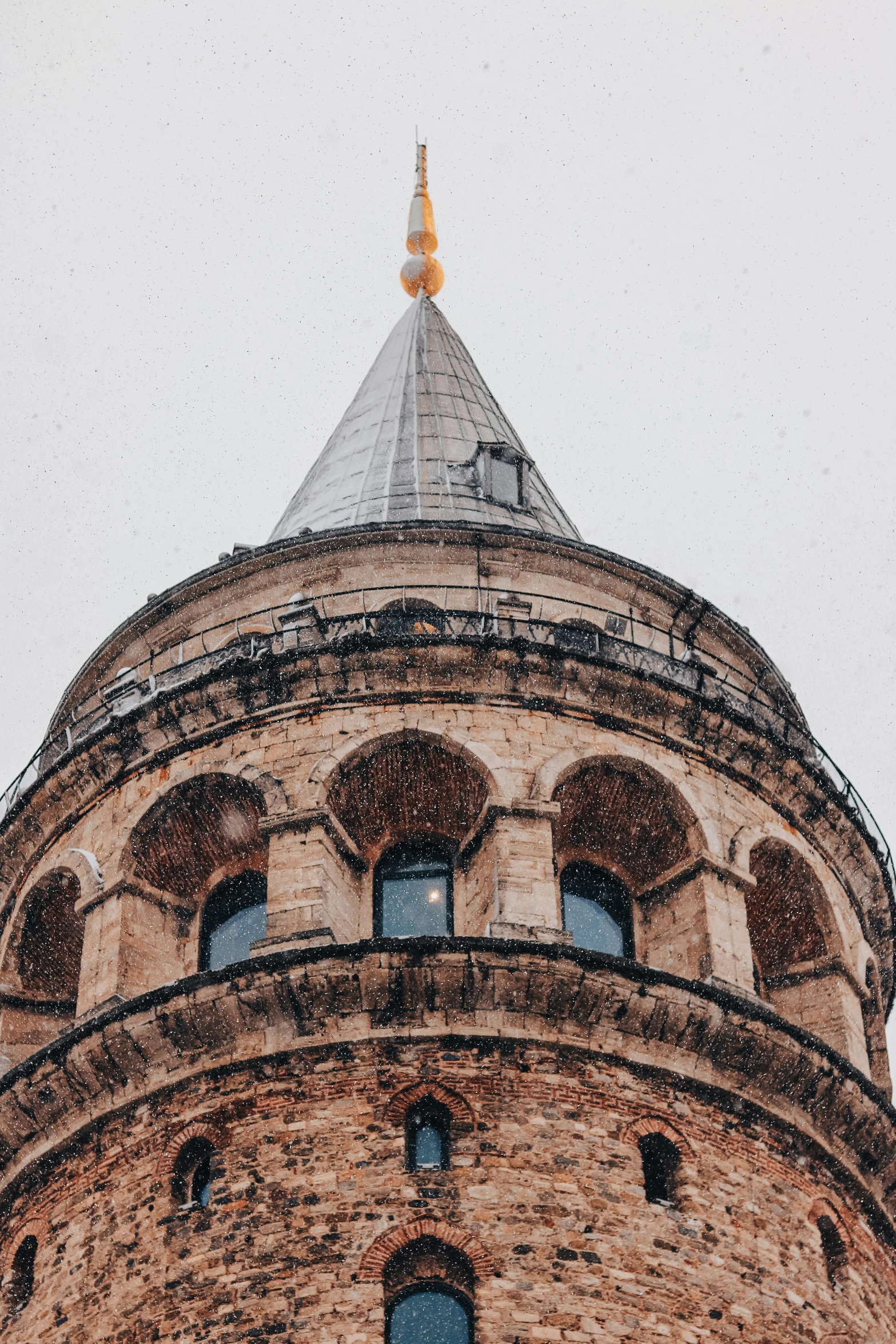 a very tall brick tower with a sky background