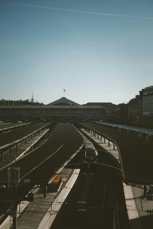 the train tracks and a building are shown