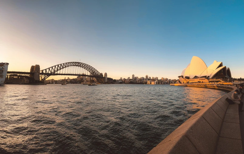 sydney harbour with the opera house and bridge in the background