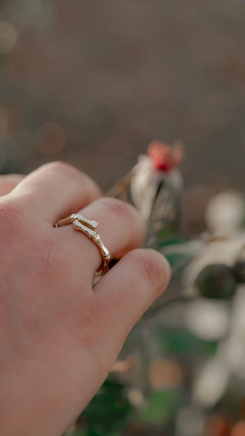 a hand that is holding some kind of object