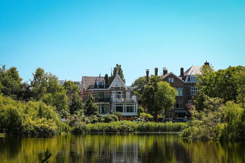 the lake reflects many homes in the reflection