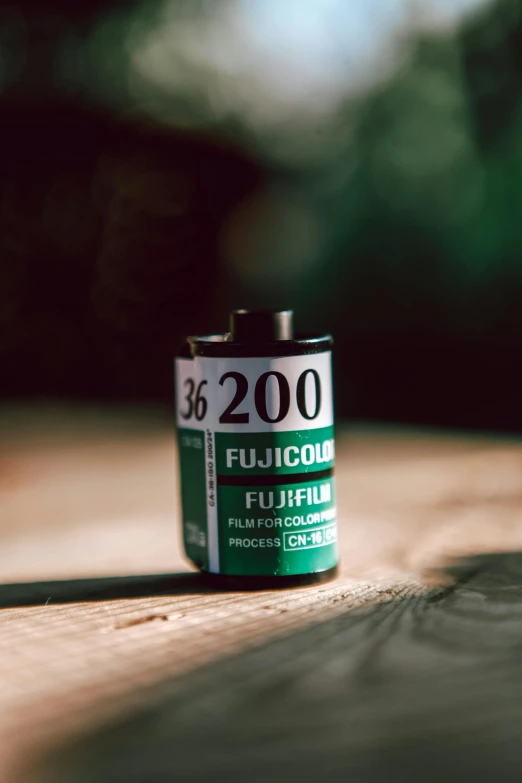 a group of batteries sitting on top of a wooden table