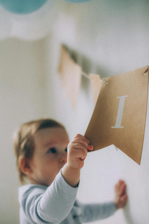 a  is holding up a little sign