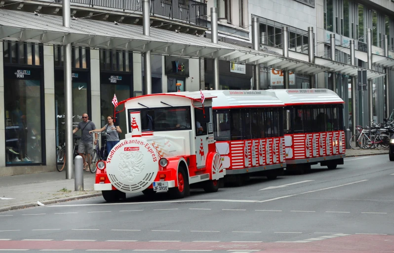 an open front bus with decorations on the side