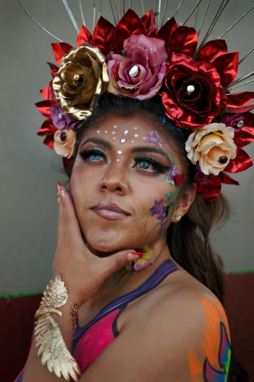 the woman is dressed in flowery makeup and has face makeup art