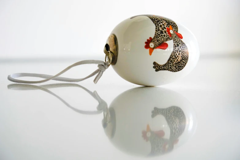 a white ceramic christmas ornament on a white table