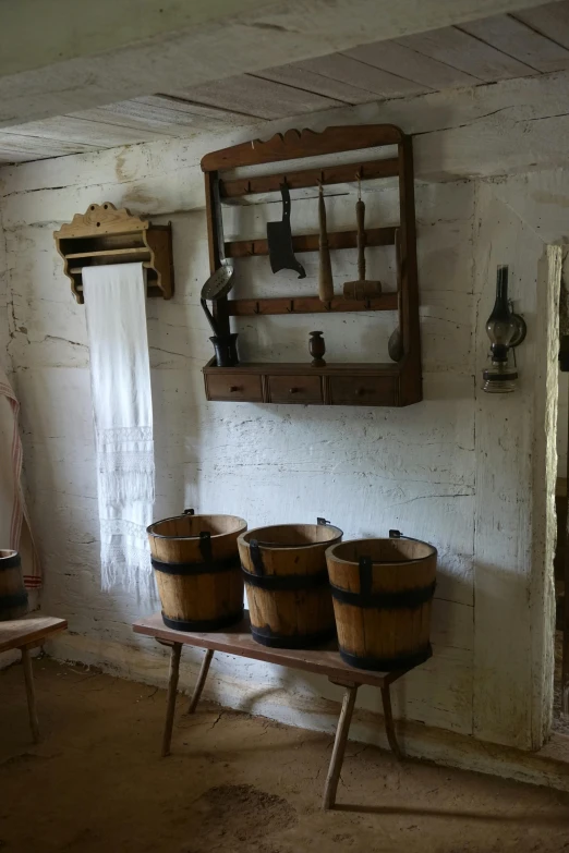 several wooden baskets on a small bench