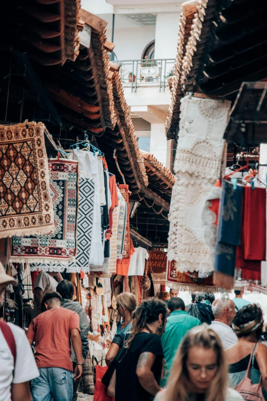 an open market with people walking by