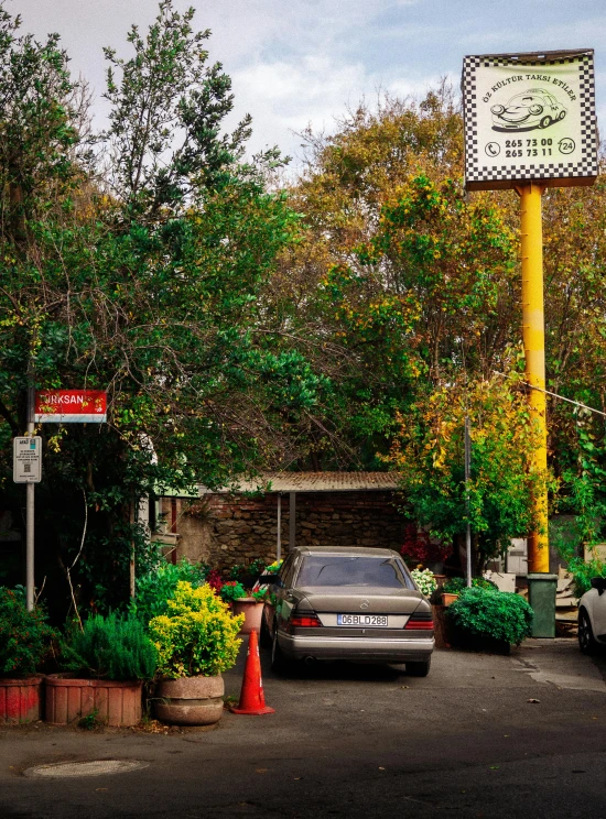 a parking lot and clock that is out in front