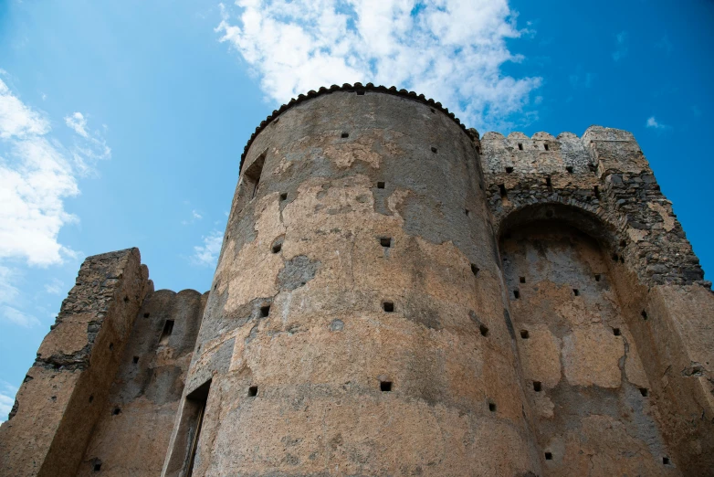 a stone structure with holes embedded into the sides