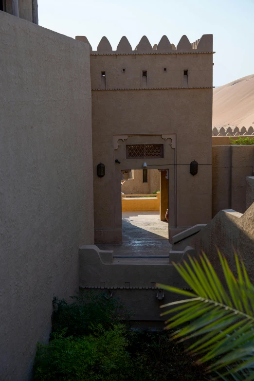 a door leads into an adobe style building