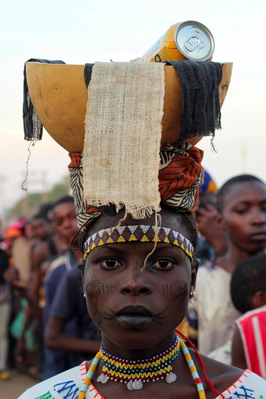 a woman wearing an elaborate head dress and other items on her head