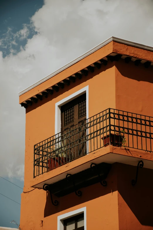 there is a balcony with pots on it