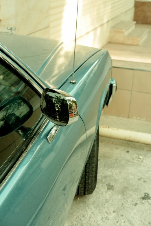 a car is parked in the driveway of a house