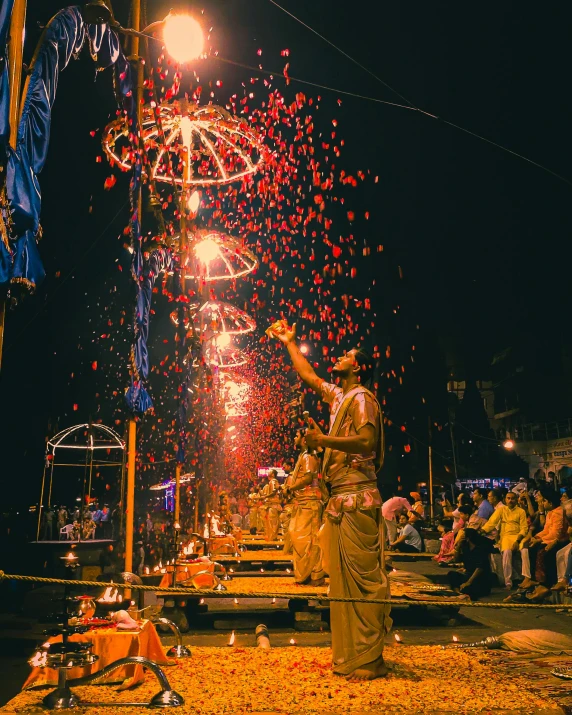 people watch fireworks at the festival while the crowd watches