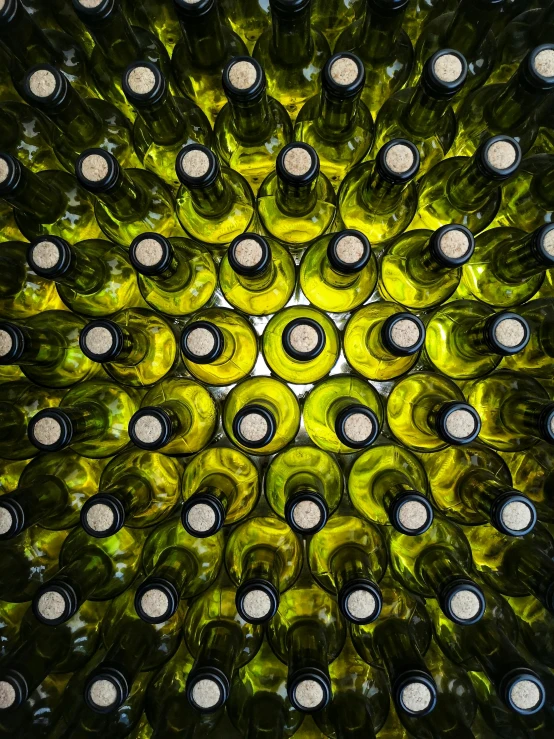 many bottles of wine are grouped in an intricate pattern