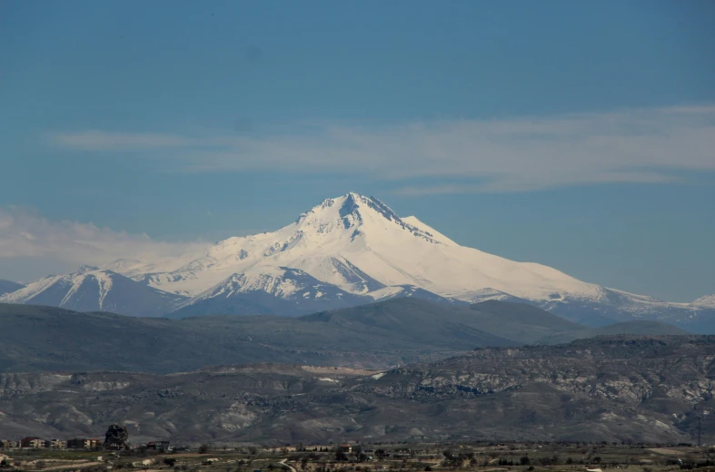 a view of a mountain peak in a sunny day