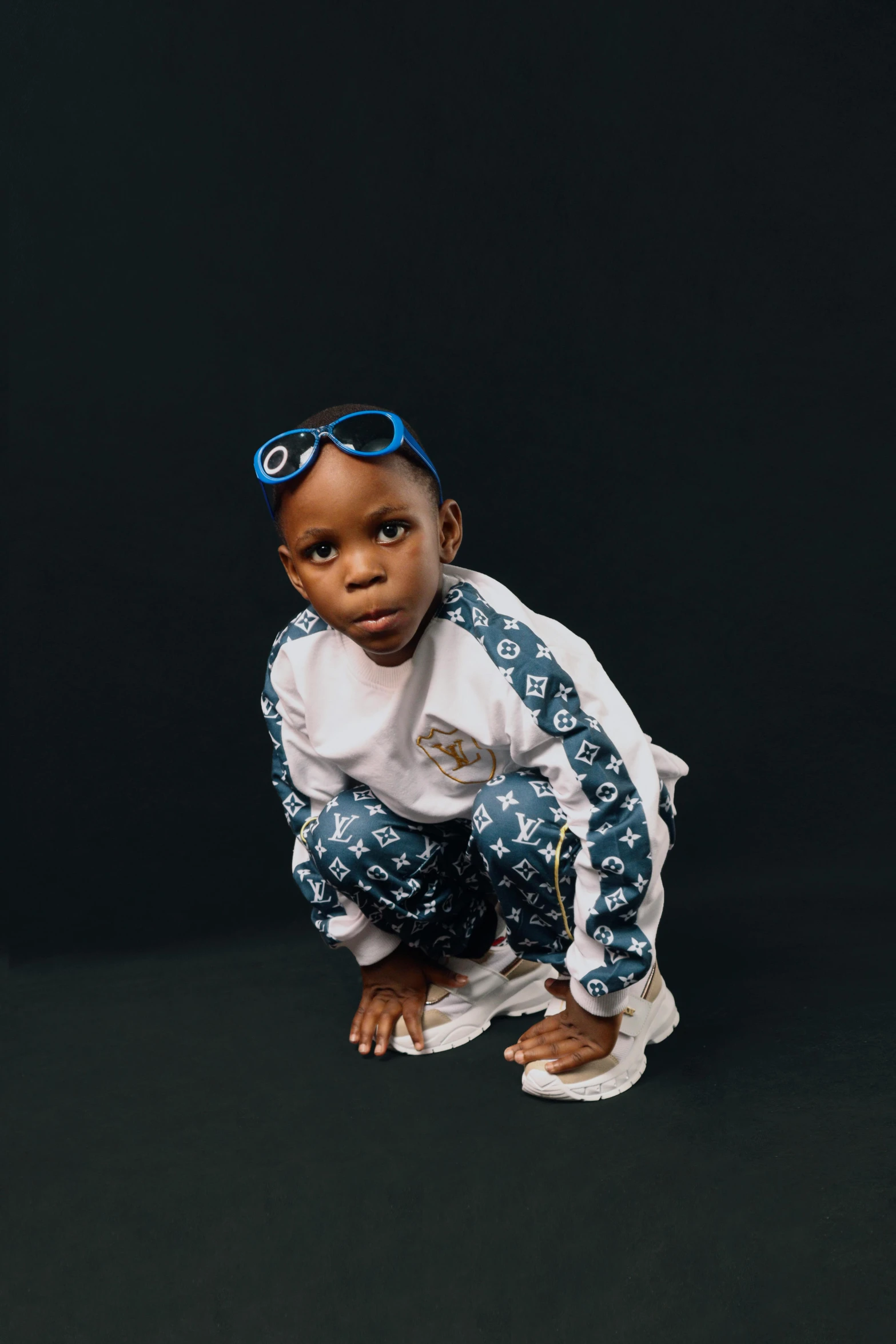 a small doll in a white and blue outfit