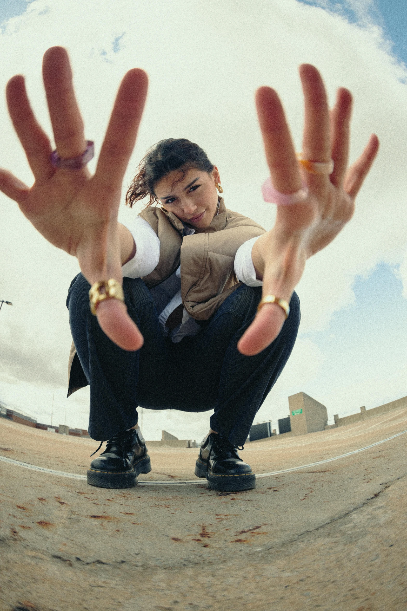 a man kneeling on the ground with his hands in front of him