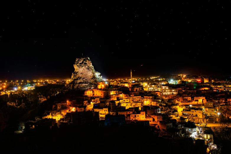 a city lit up at night with its lights turned on