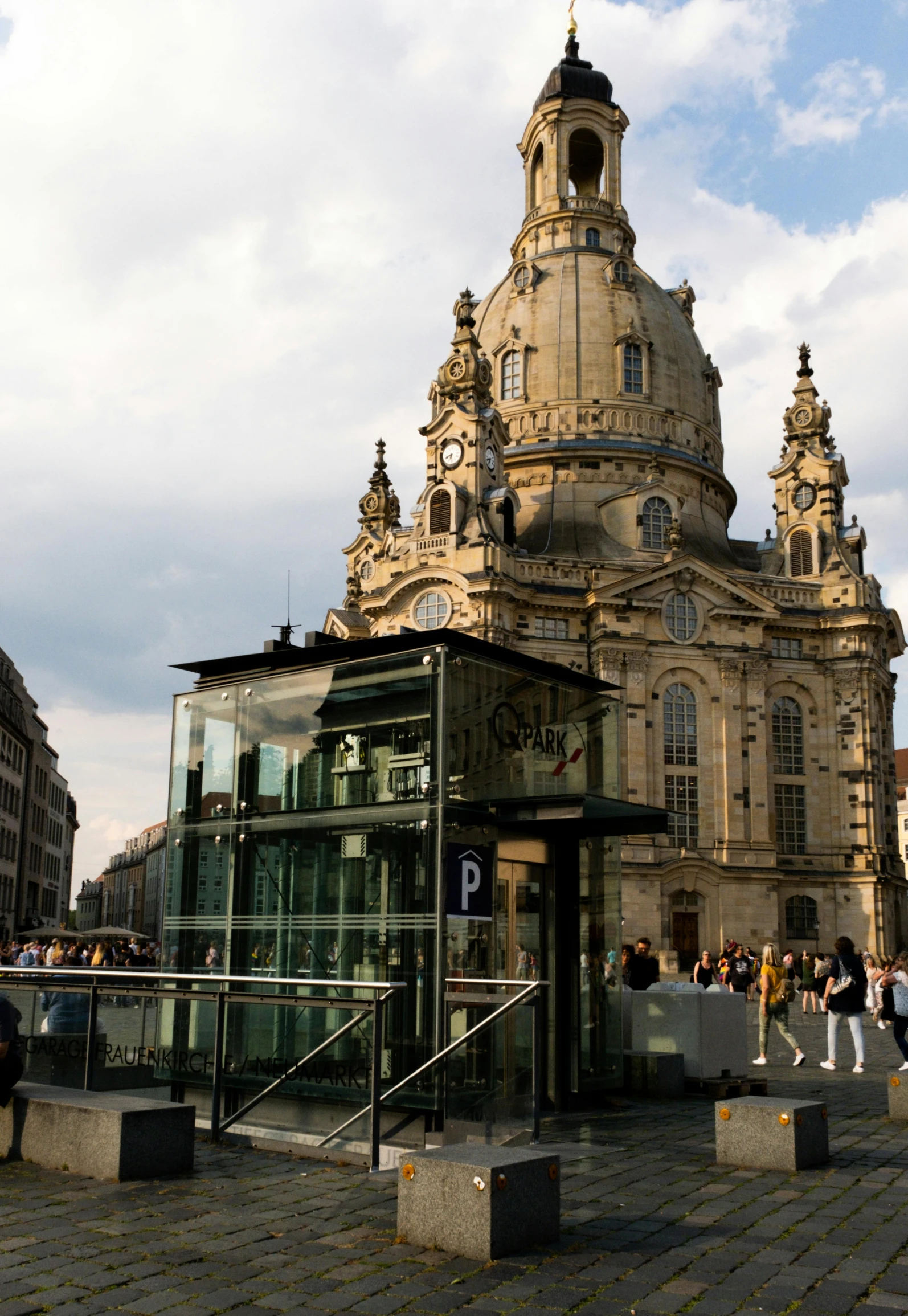 a large building on a cobble stone sidewalk