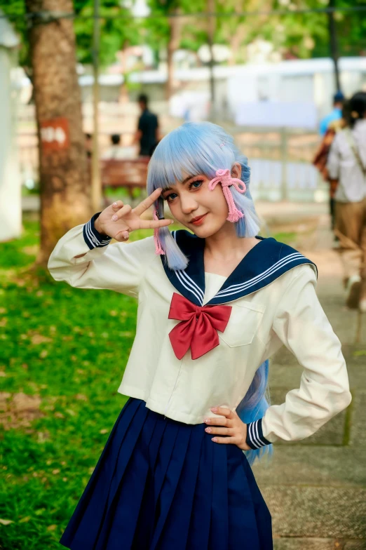  in sailor uniform poses with her hands on the head