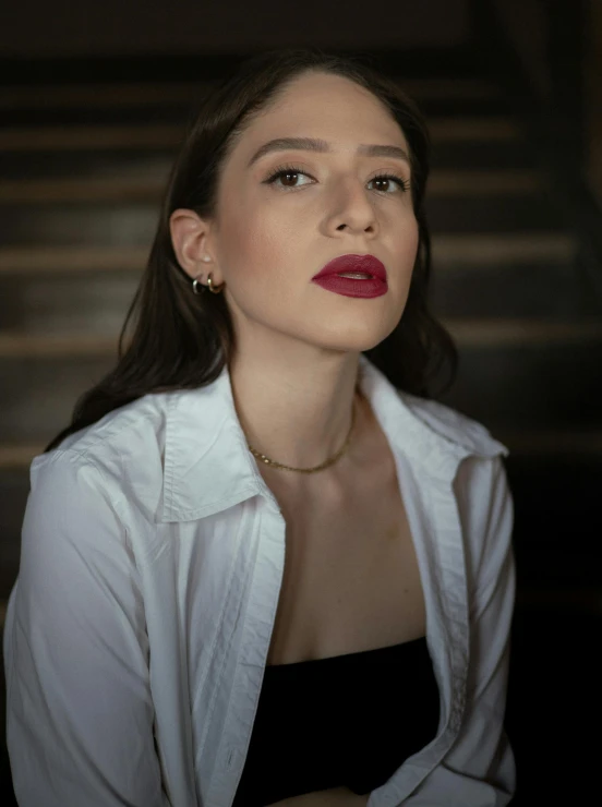 a woman with red lips and a jacket