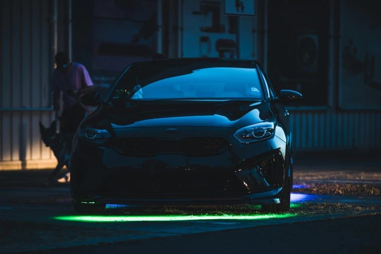 the back of a black car, with lights on