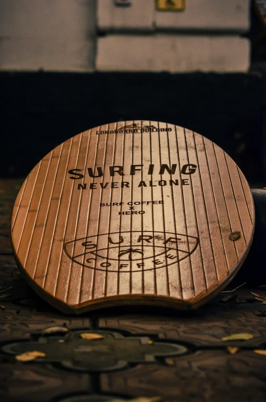 a circular wooden sign with writing on it