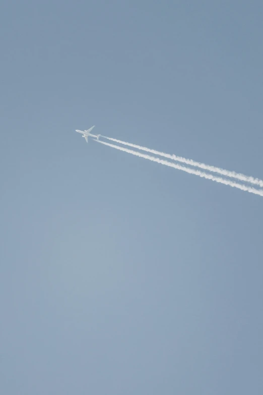 a jetliner with its tail flying through the sky