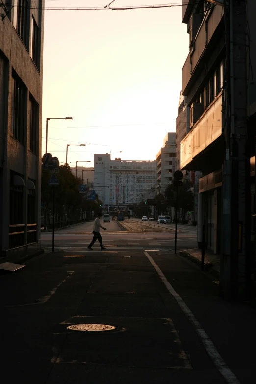 the person is walking alone down an empty street