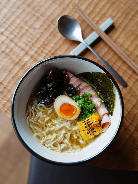 a couple of bowls on a table filled with soup