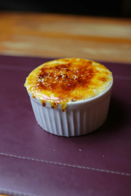 a baked pastry in a ceramic dish on a counter