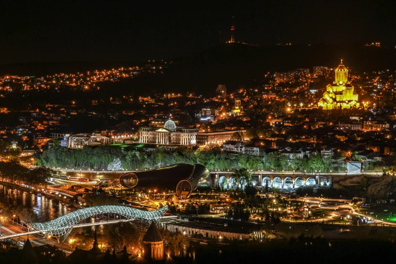 a city lit up at night in a dark place