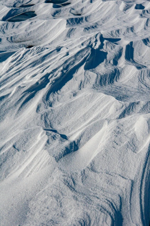 a person skiing across a snowy mountain with no snow