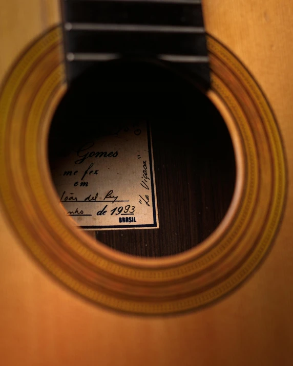 a po of a guitar with a label in the center