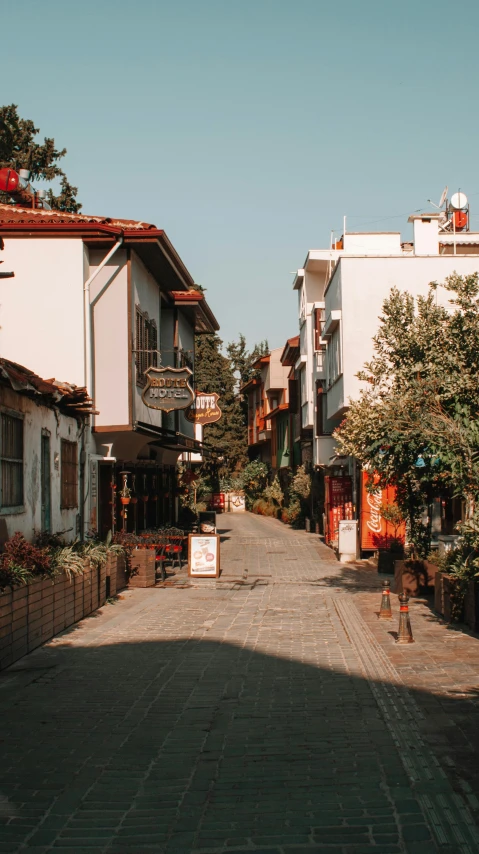 a very long street with small buildings