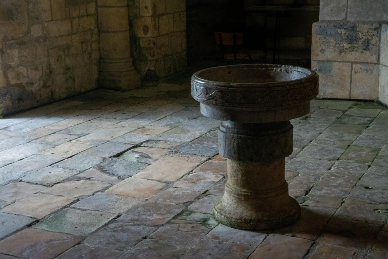 the light is shining down on a stone floor