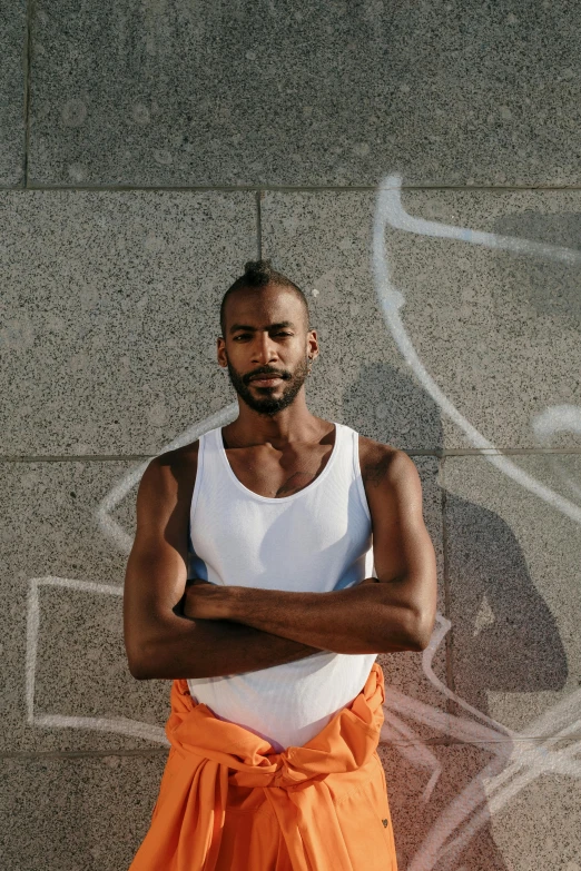 an african american man with his arms crossed