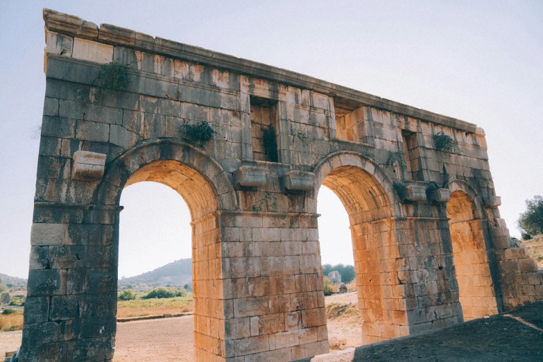 the arch in the wall is made of stone