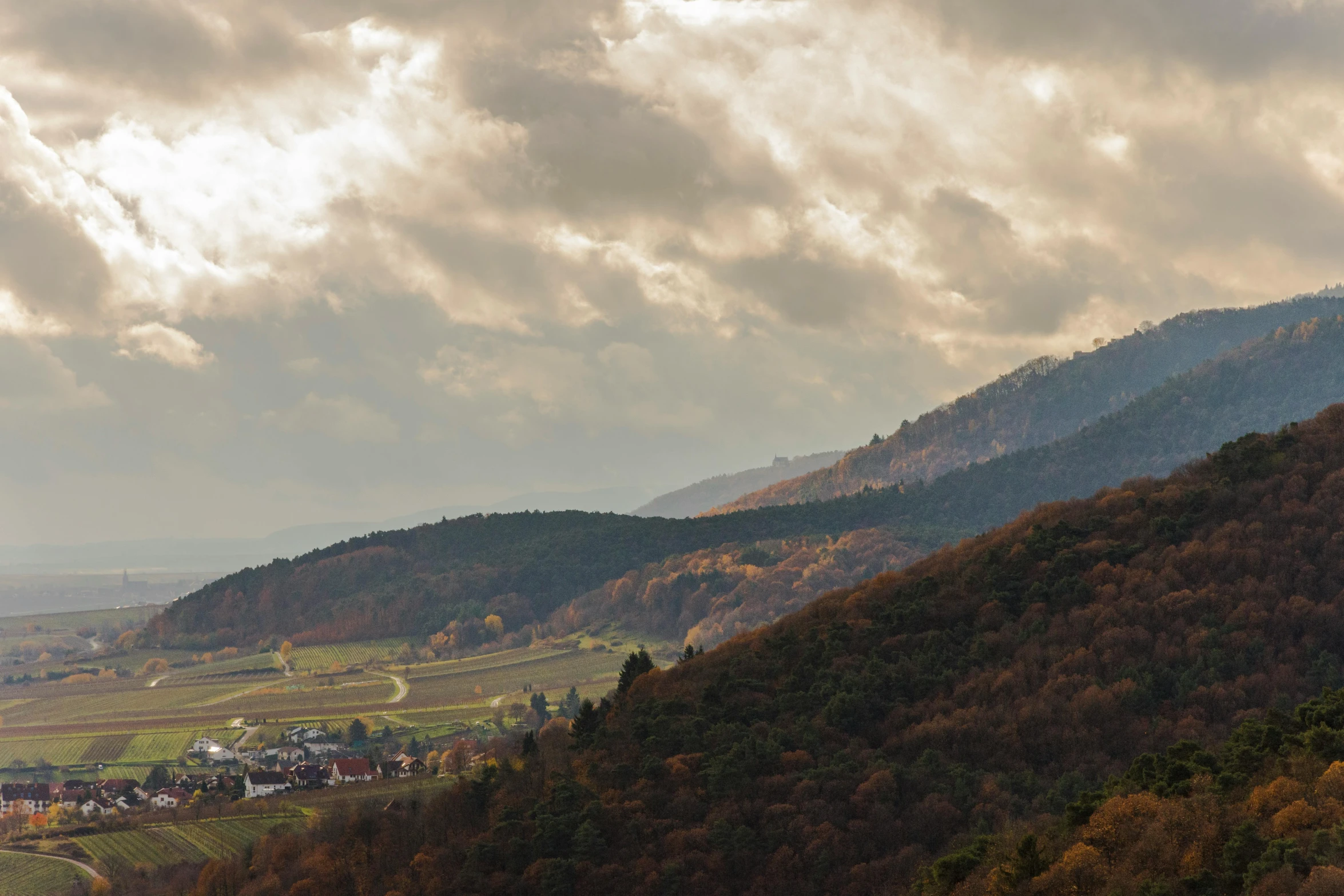 hills and mountains are surrounded by the clouds