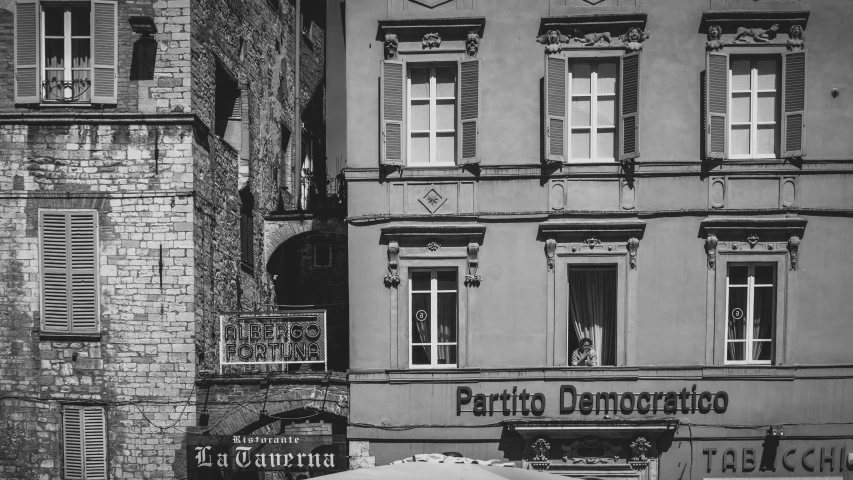 an old building with some signs on the front